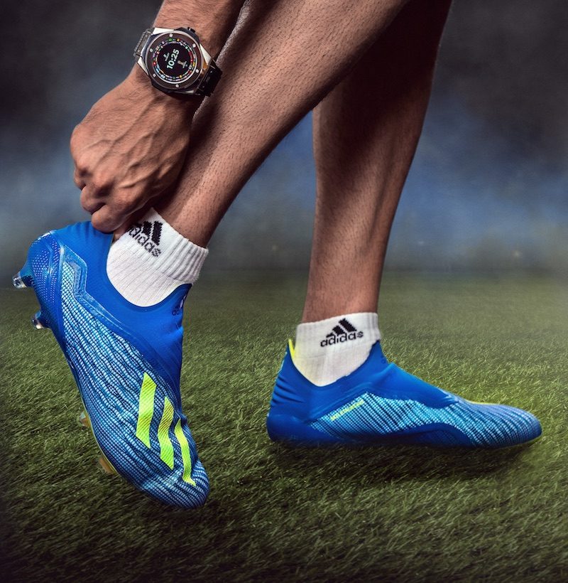 Enamoring frame this is with the 49mm large dial FIFA smartwatch by Hublot gripping the wrist with its lined black rubber strap that is perfect for sports watches.